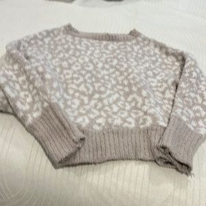 Cream and white print cozy sweater.